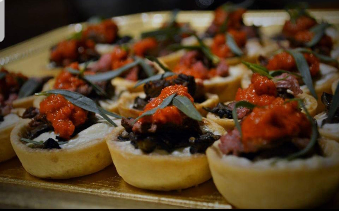 Chef Mimi’s Wontons Stuffed with Flank Steak, Mushrooms and Goat Cheese Garnished with Red Bell Peppers