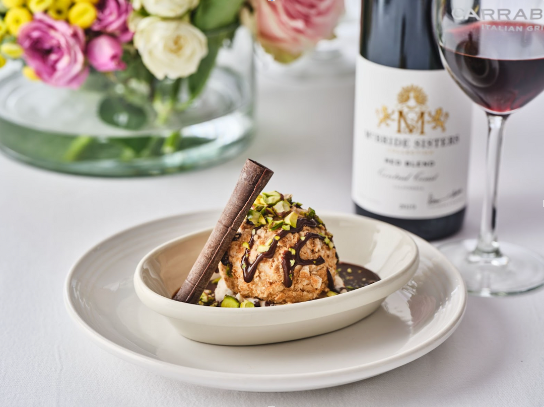 Cannoli Cream Vanilla Ice Cream Sundae with Crushed Cannoli Shell, Pistachio & Chocolate Drizzle