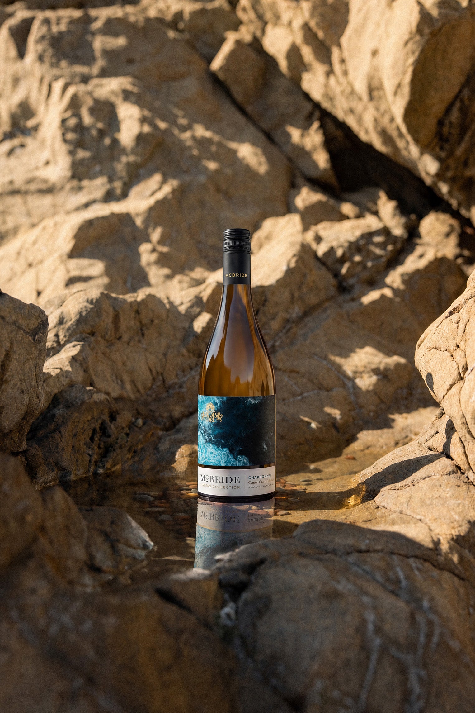 McBride Sisters Collection Chardonnay wine bottle with blue label and black cap