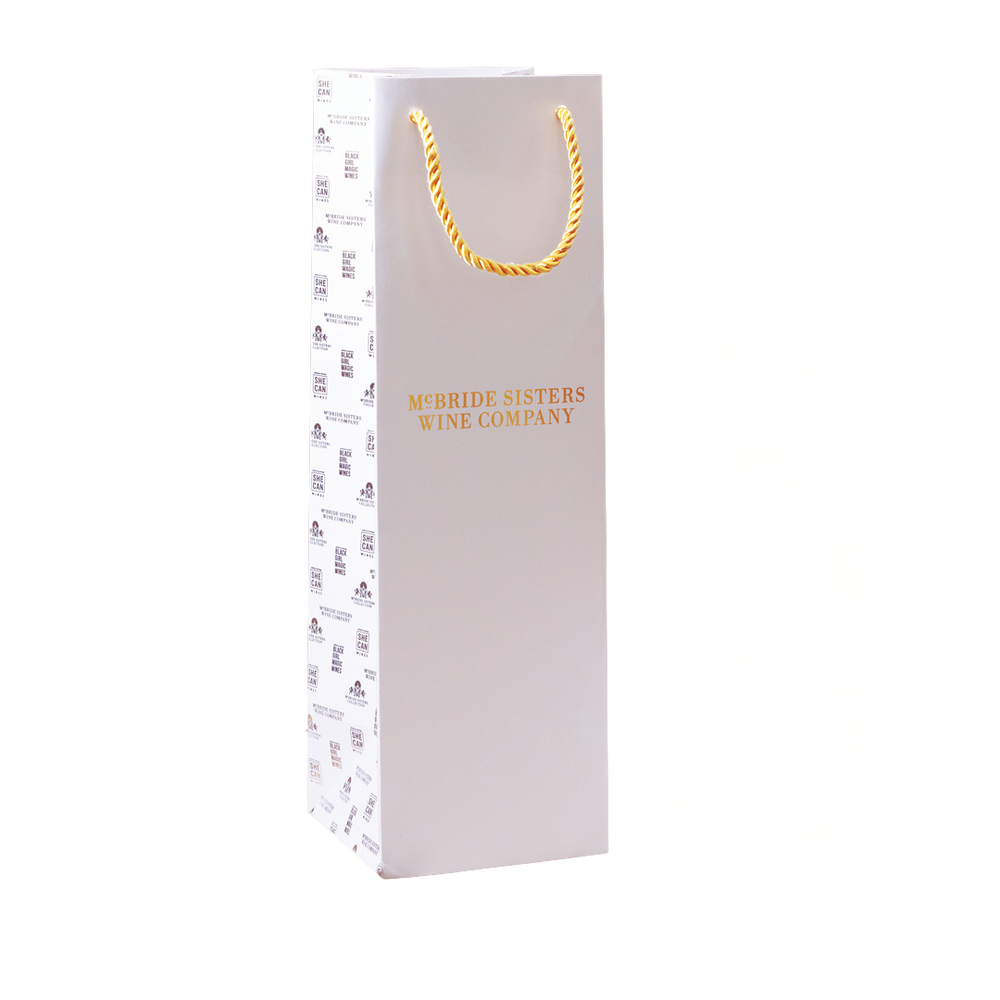 White wine gift bag with gold rope handles, McBride Sisters Wine Company logo