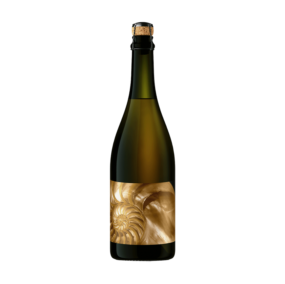 A dark green glass bottle with a cork and black neck seal, featuring a prominent gold label with a nautilus shell design, isolated on a white background.