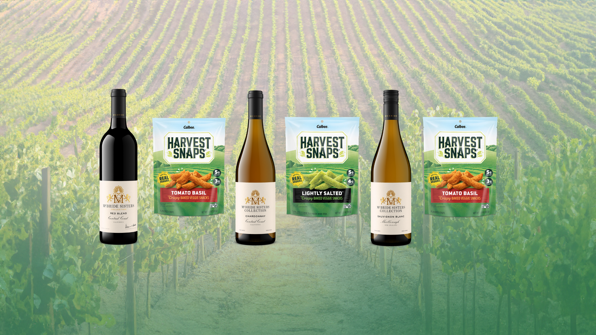 Three bottles and three bags of Harvest Snaps arranged in a row against a blurred vineyard background. The products include a red wine bottle, a chardonnay wine bottle, and a sauvignon blanc bottle of wine with three green seasoning bags.