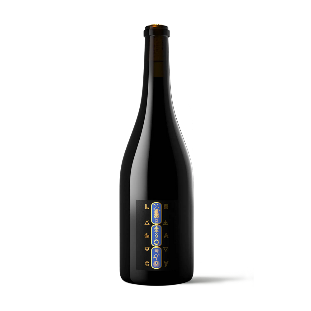 A dark glass bottle of wine with a black label featuring gold and blue accents, photographed against a solid white background.