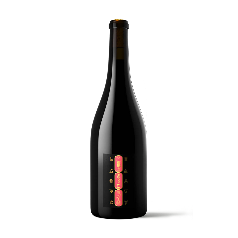 A dark glass bottle with a black label featuring vertical pink and gold lettering, photographed against a clean white background.