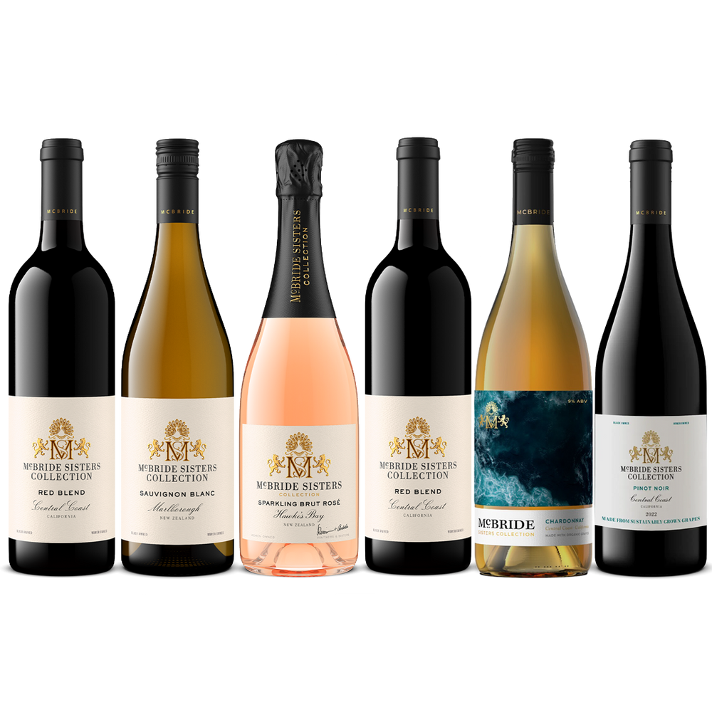 Six bottles of McBride Sisters Collection wine arranged in a row against a white background, including red, white, and rosé wine varieties.