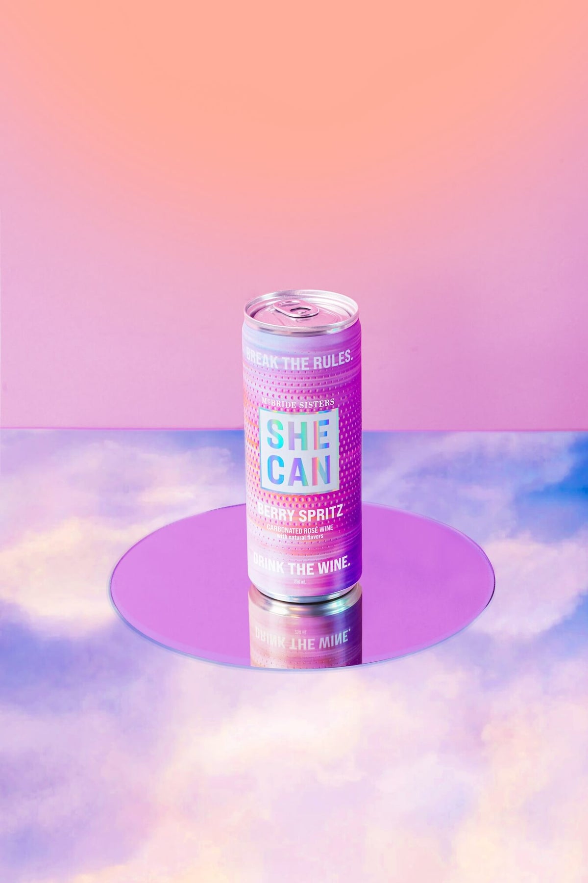 SHE CAN Berry Spritz slim can with pink and purple label and silver top