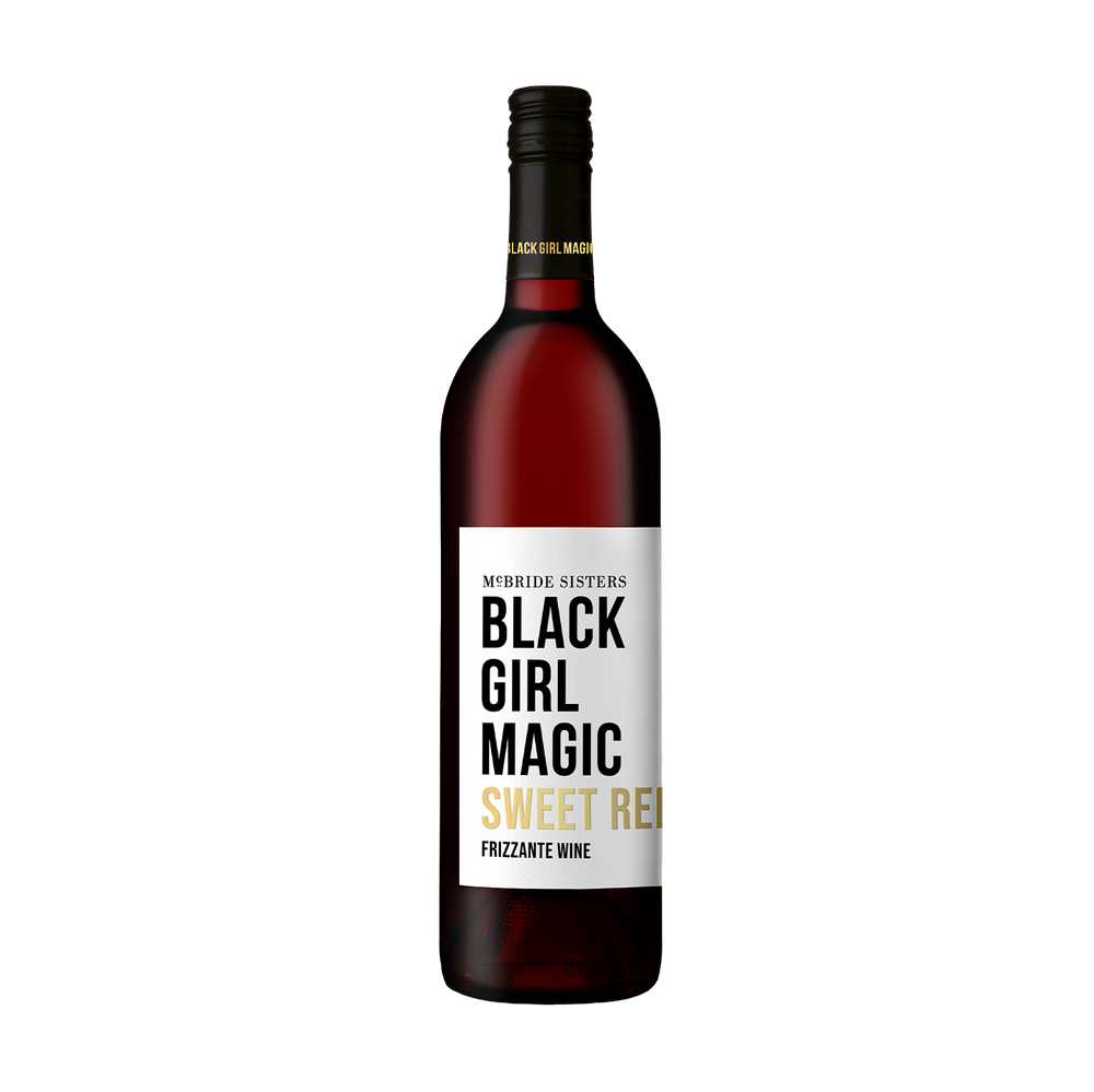 A bottle of McBride Sisters Black Girl Magic Sweet Red Frizzante Wine, featuring a white label with black and gold text, set against a plain white background.