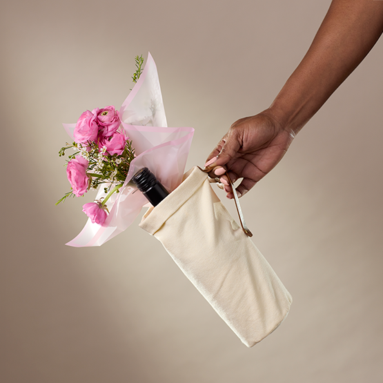 Cream canvas tote bag with long handles, held open